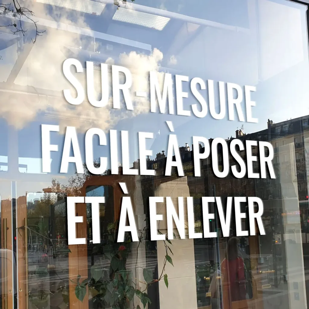 Custom-cut adhesive lettering and window decals for storefronts and signage
